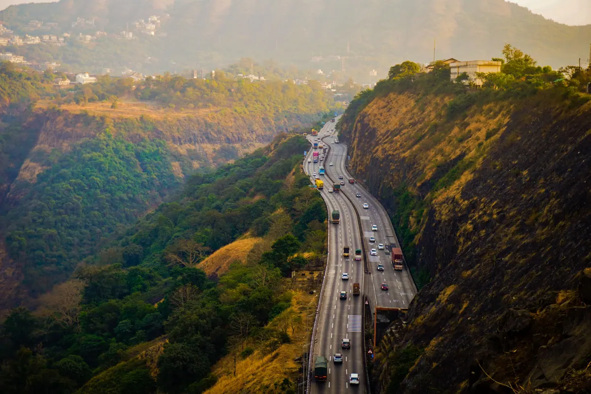 The expressway winding through the hills of the ghat section near Lonavala