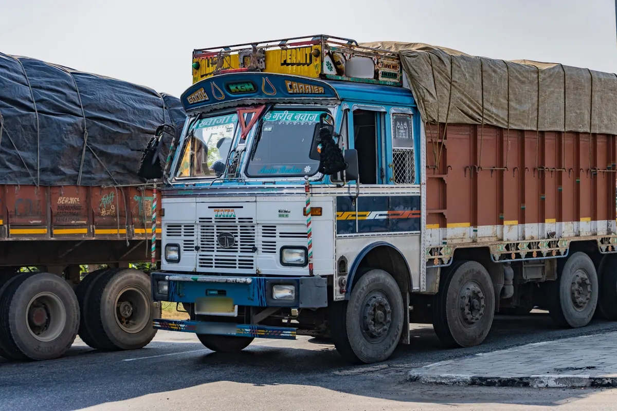 A painted Tata goods truck seen head-on on a highway